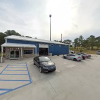 Automotive service center exterior and shop area
